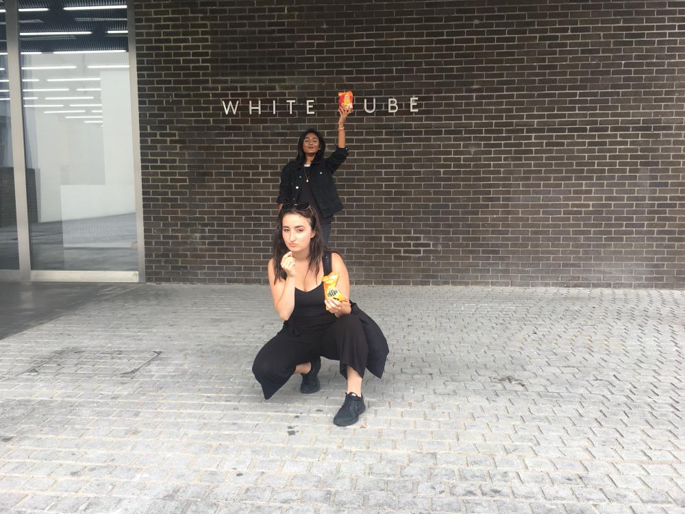 gab and zarina posing with crisps outside the white cube bermondsey