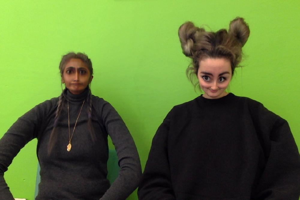 photobooth pic where gabs head is massive like an alien and zarina's is shrunken