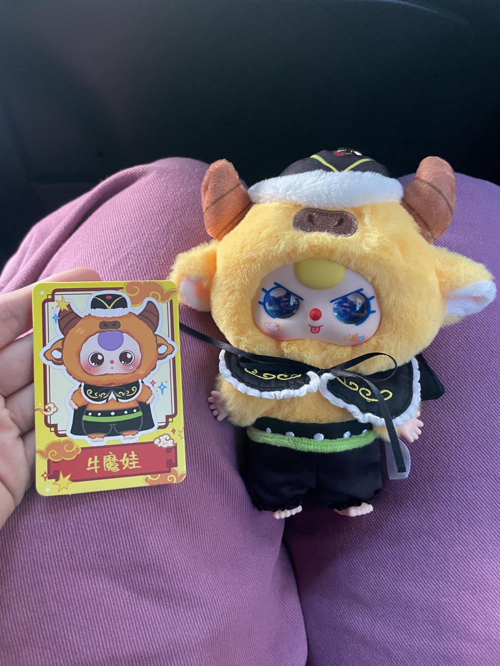 the bull demon next to the card illustration of it, the card picture has plain brown eyes but mine is sparkling blue