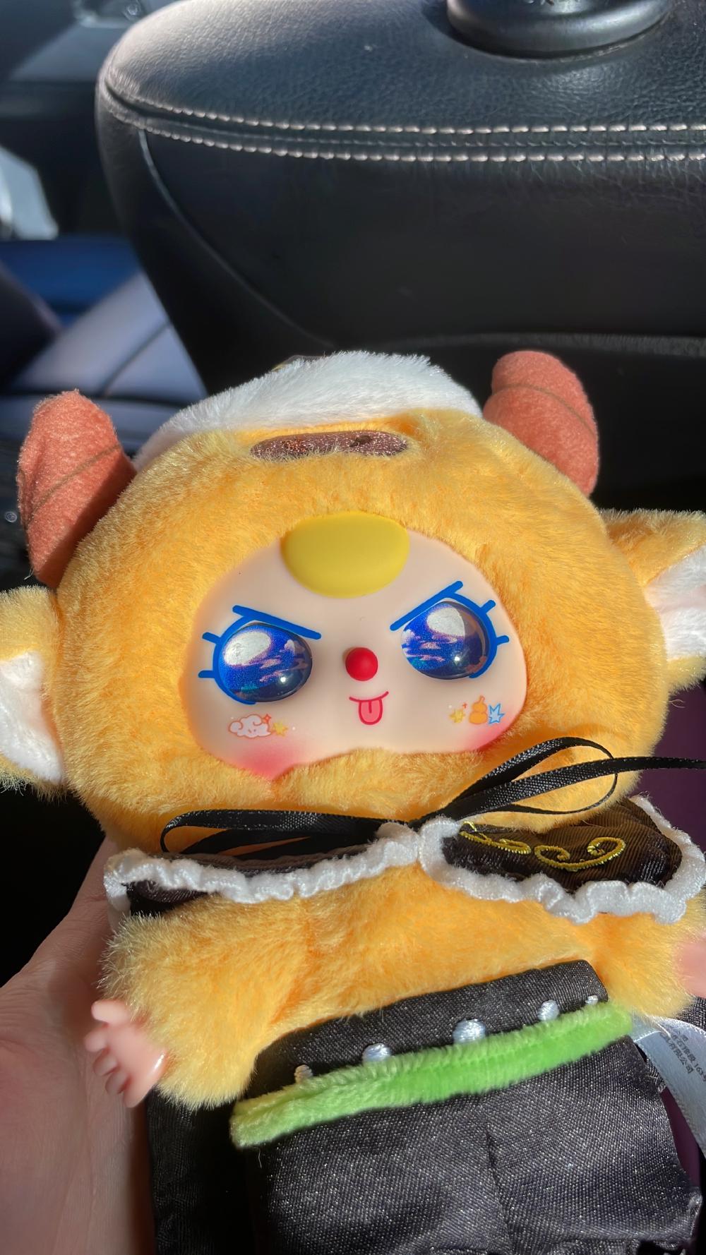 the face of the toy shining in the sun with little clouds in the eyes