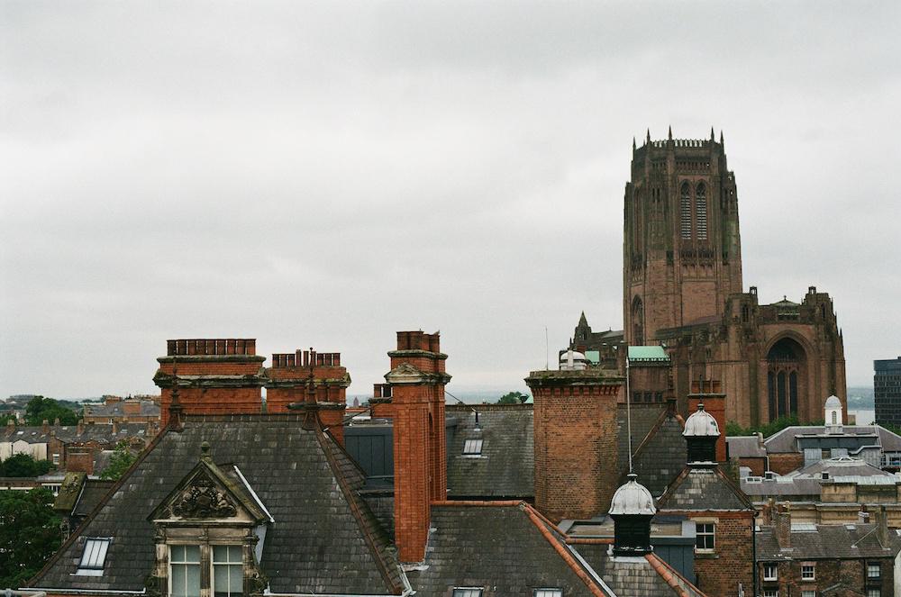 Anglican cathedral with rooftops in Liverpool