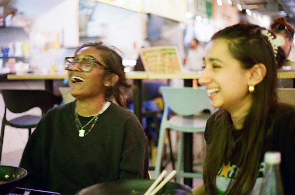 Zarina and Priya mid-laugh and mid-blur