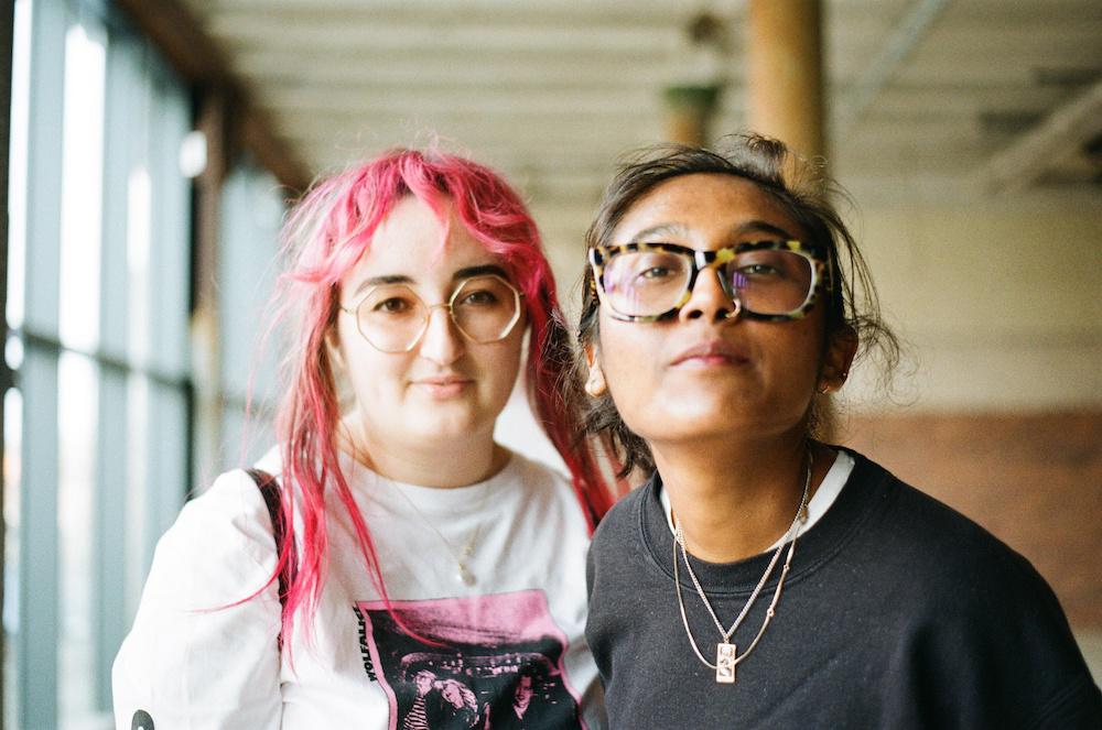 gab and zarina both wearing funky glasses, gab's are octagonal and tinted and zarina's are tortoise shell and chunky