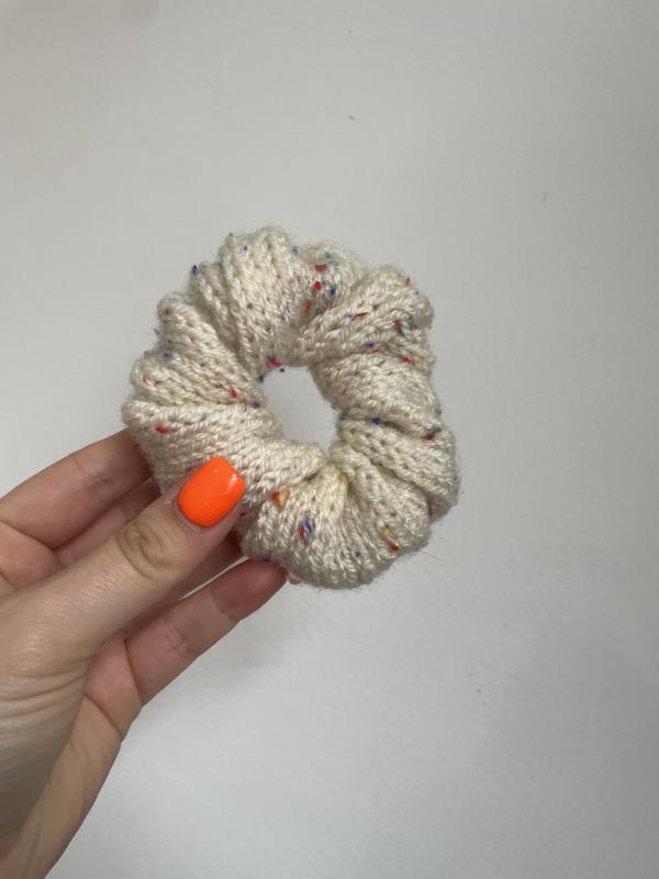 a beige knitted scrunchie