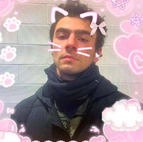 a kawaii edit of a picture of luigi mangione with cut cat ears and whiskers and pink fluffy clouds