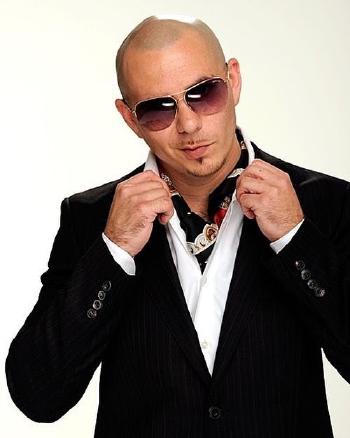 pitbull, the singer, wearing brown aviator sunglasses, popping his collar and smirking