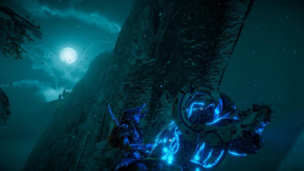 Aloy rides a machine at night, and the sky behind has a huge moon, and the machine, her mount, is outlined in dark blue lights along its components