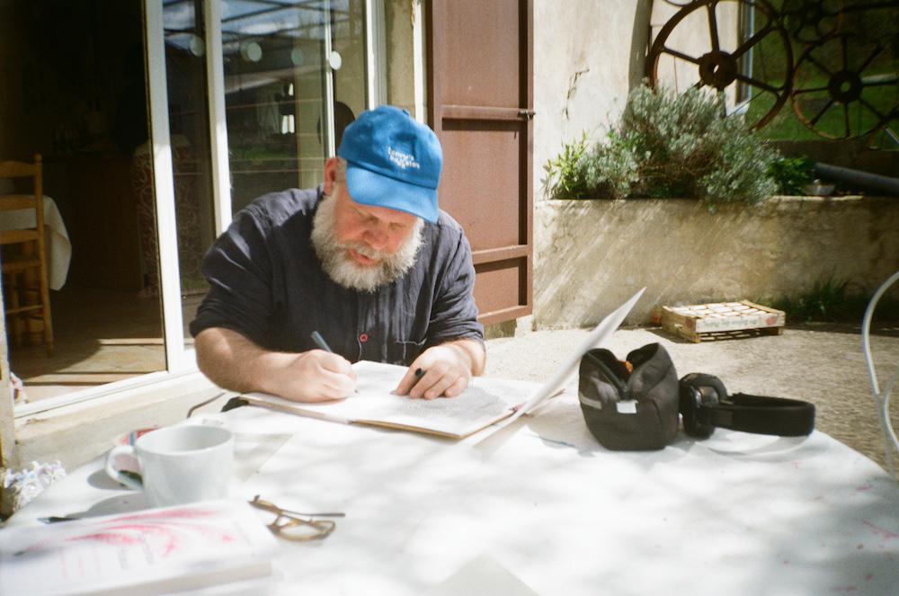 Rob working on drawings at the same table on another day