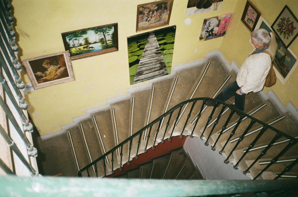 Anita walking down the stairs in Emmeus, a flea market type place