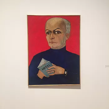 a remarkable painting of a half bald man holding a tiny book and he&rsquo;s got a turtle neck on and it&rsquo;s pretty cool