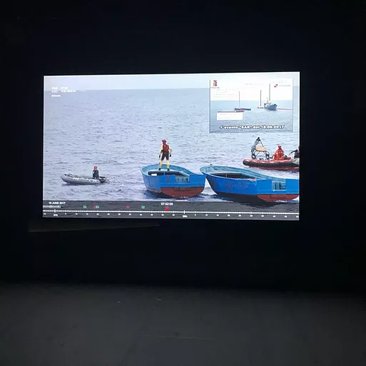a video of three ships and someone in the centre is standing on top of one of them