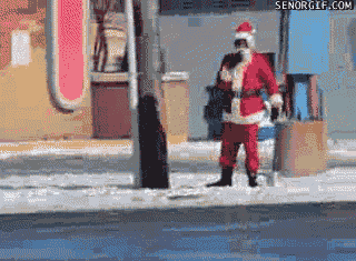 father christmas is dancing on a snowy street