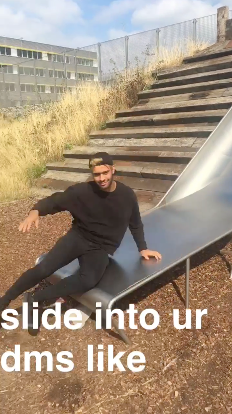 Aaqib is at the bottom of a big metal slide with the words &lsquo;slide into your dms like&rsquo; on top