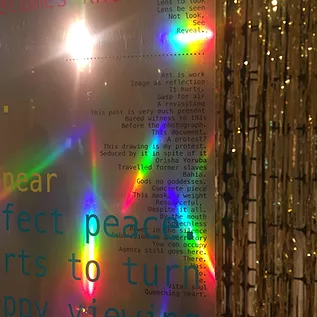 reflective silver print shines rainbows back to the camera