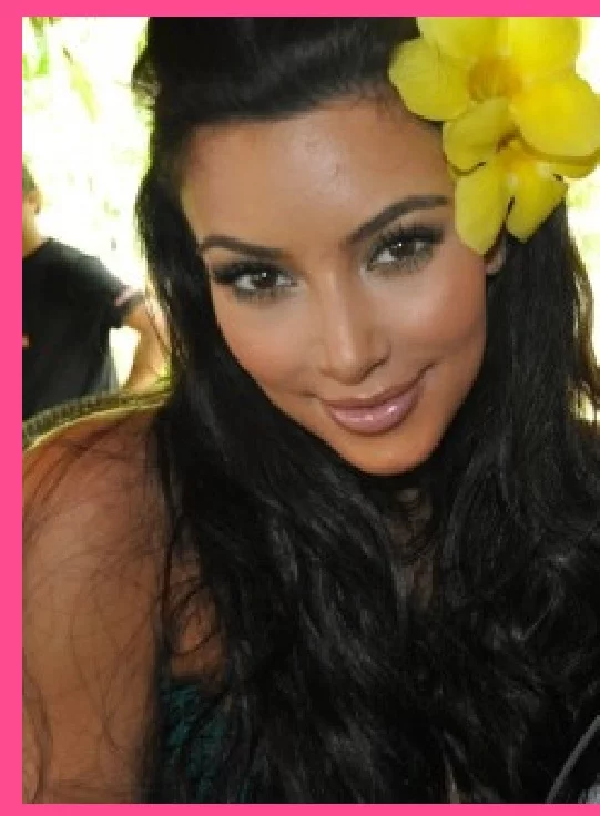a classical kim kardashian selfie where she has a big flower in her hair