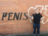 and now GT is stood next to a bit of graffiti that just says PENIS really big