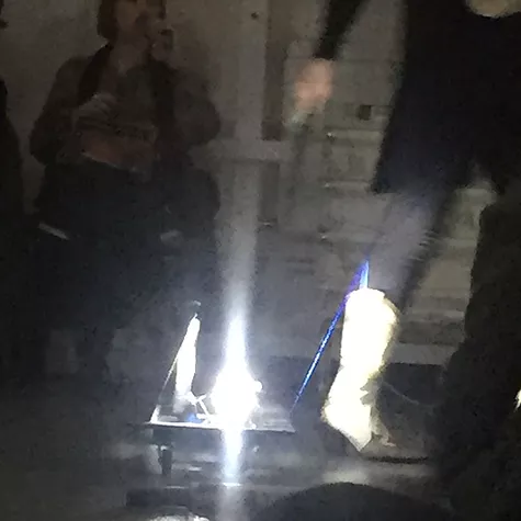 another obscure image of someone passing in front of a light on the floor