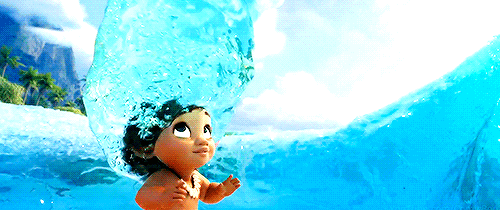 a gif of a toddler moana having a magic hair transformation by pooling water spinning around her head