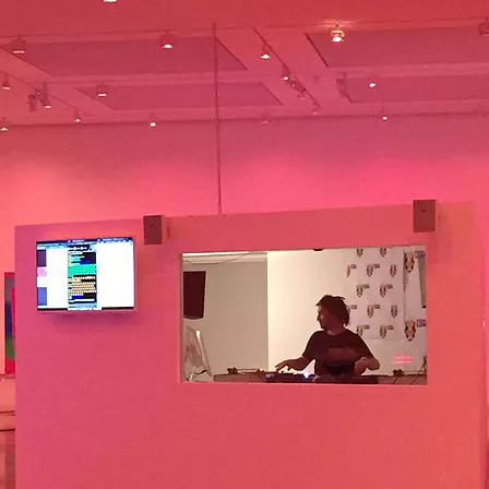 someone is DJing in the gallery