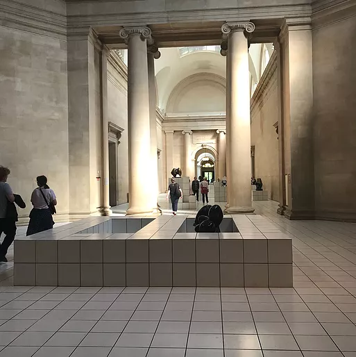 a shot in the big halls in the middle of Tate Britain showing the full tiled space with more raised parts, like you might have water in for a fountain or water feature