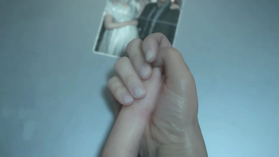 BB&rsquo;s tiny hand is being held by Sam&rsquo;s, next to the old image from Sam&rsquo;s wedding that he has kept with him all this time