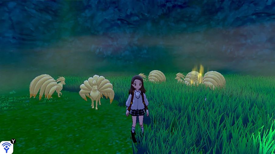 Gab&rsquo;s character has black hair now and she&rsquo;s wearing a white fleece with a school skirt and boots, and behind her in the grass there is a group of ninetales