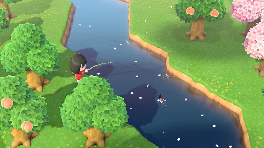 Gab's tiny animal crossing character is stood fishing while cherry blossoms land on the water