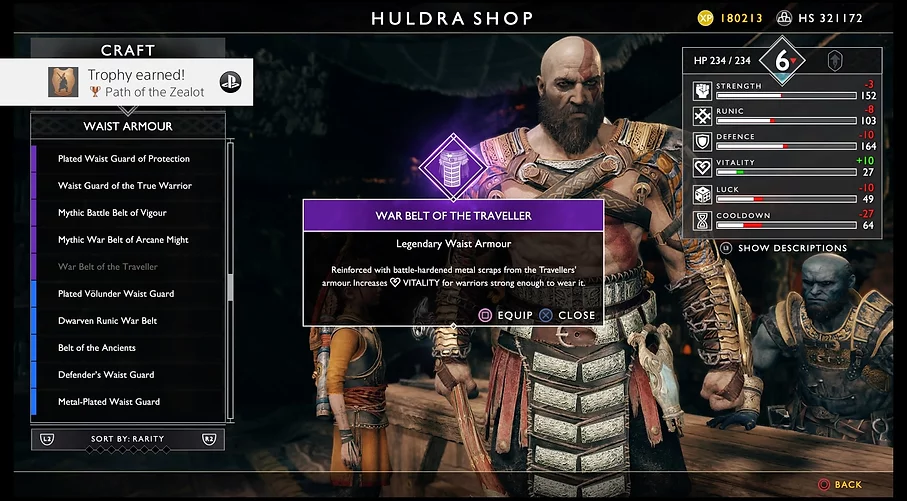 a menu screen shows the player changing Kratos' armour and donning the war belt of the traveller, a legendary piece that increases vitality