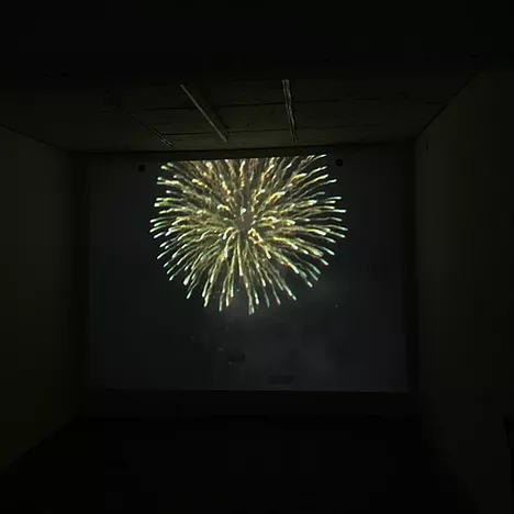 an image of the new years eve video projected showing a big firework