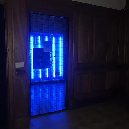 there are strips of blue light visible through a window