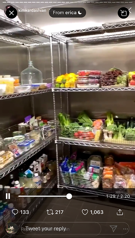 a screenshot of kim kardashians instagram story which shows the inside of her pantry full of fresh vegetables and other food items on shelves