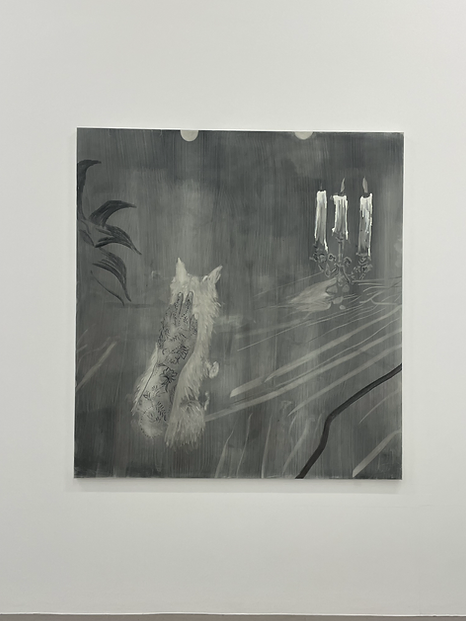 a grey washy white painting on a wall is abstract, with a few leaves in detail, and some candles too