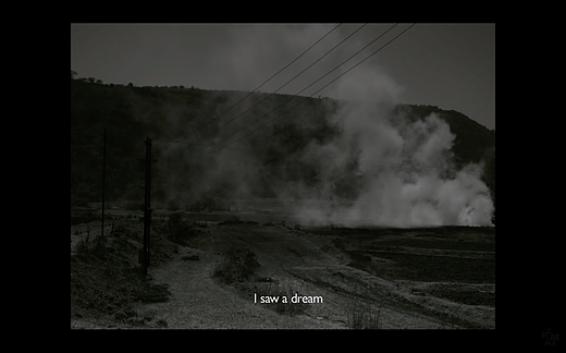 empty rocky wilderness shows smoke rising up over the floor in black and white with the caption I saw a dream