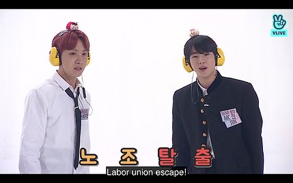 two of the BTS boys are wearing noise defenders and the caption says Labor union escape