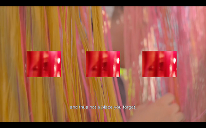 confetti like streams of colour in yellow and pink are hanging down with three small squares of red overlaid on top, and the caption says &lsquo;and thus not a place your forget&rsquo;