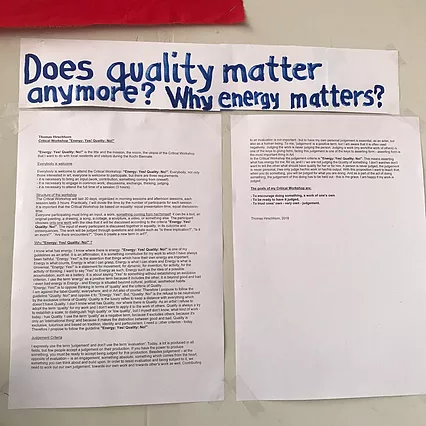 pieces of paper on the wall are stuck under a title that says does quality matter anymore? Why energy matters? And there is an essay below that is too small to read