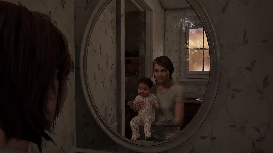 Ellie stands in a mirror holding a little baby