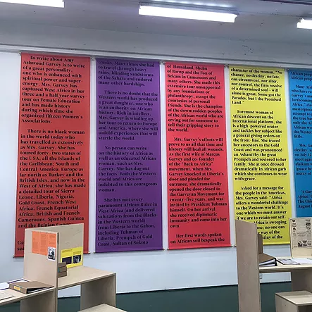 colourful banners hang down the wall with writing on them
