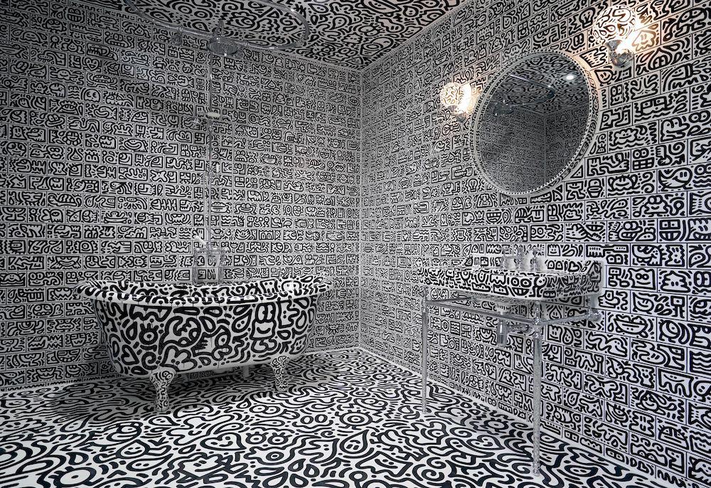 a bathroom covered in doodles