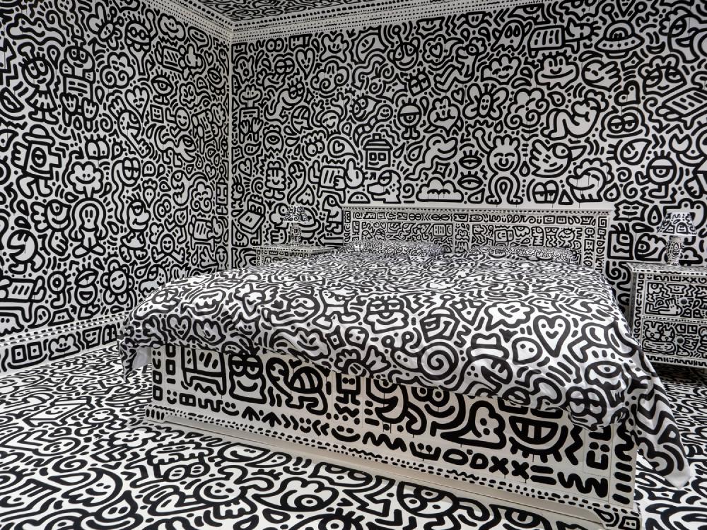 a bedroom covered in doodles