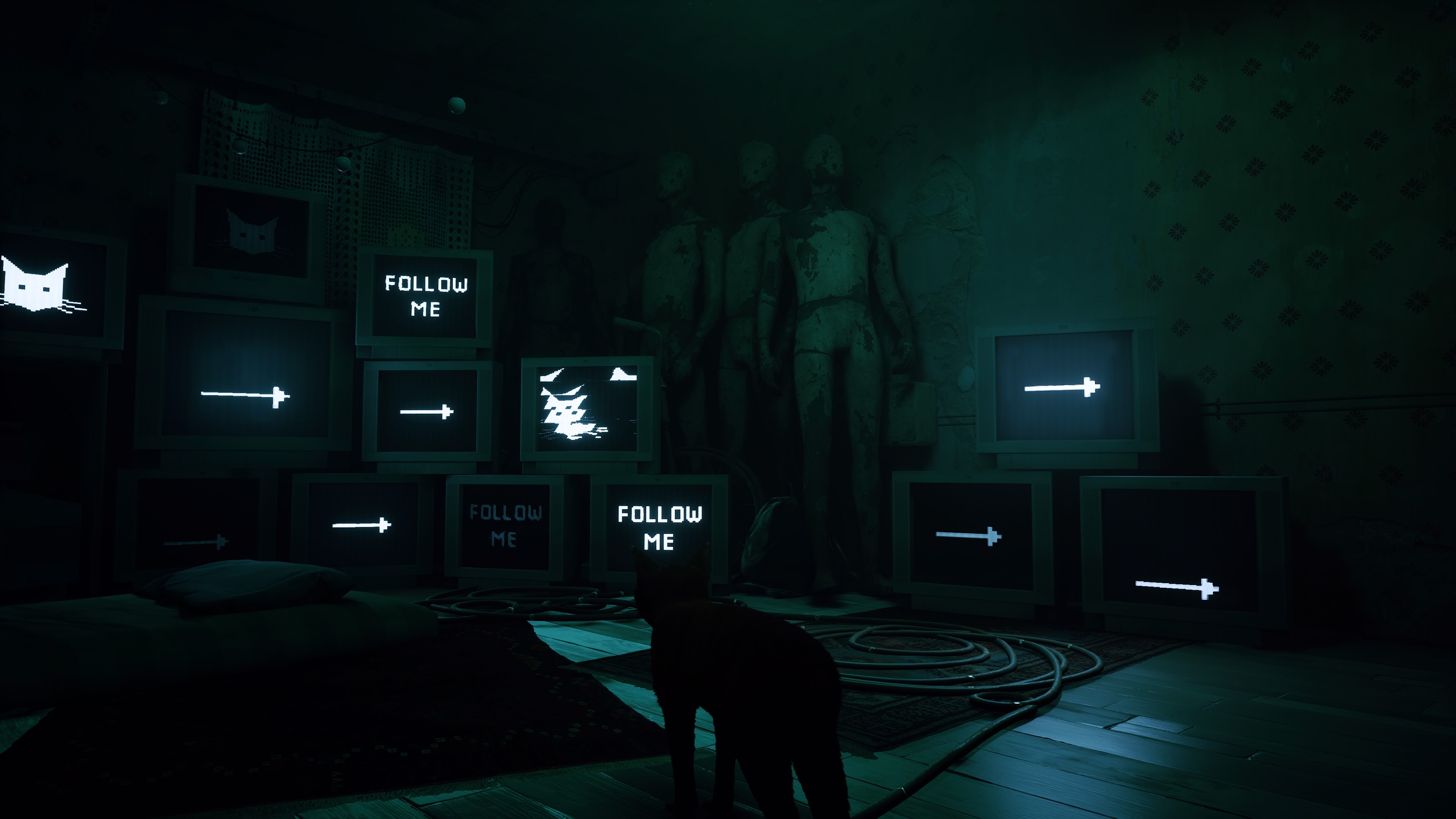 a screenshot from the beginning of stray where it's dark and a bunch of stacked computers with convenient arrows and 'follow me' instructions on it direct the player