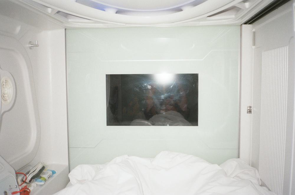 kind of hard to make up because of the flash, but this is a mirror selfie inside the bright white capsule